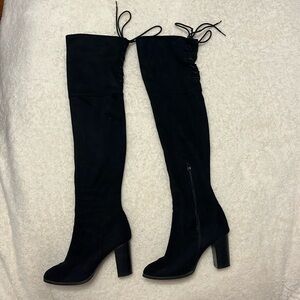 Knee high black heeled boots